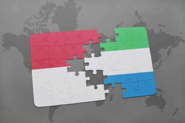 bir dünya haritası arka plan üzerinde endonezya ve sierra leone ulusal bayrağı ile bulmaca.