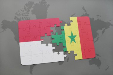 bir dünya haritası arka plan üzerinde endonezya ve senegal ulusal bayrağı ile bulmaca.