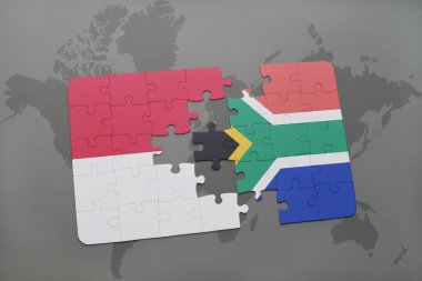 bir dünya haritası arka plan üzerinde Endonezya ve Güney Afrika ulusal bayrağı ile bulmaca.