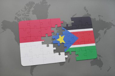 bir dünya haritası arka plan üzerinde endonezya ve güney sudan ulusal bayrağı ile bulmaca.