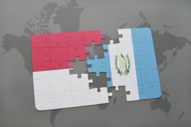 bir dünya haritası arka plan üzerinde endonezya ve guatemala ulusal bayrağı ile bulmaca.