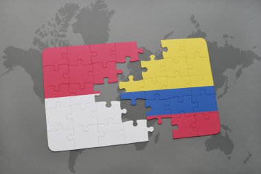 bir dünya haritası arka plan üzerinde endonezya ve kolombiya ulusal bayrağı ile bulmaca.