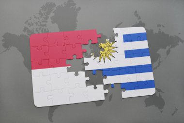 bir dünya haritası arka plan üzerinde endonezya ve uruguay ulusal bayrağı ile bulmaca.