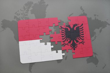 bir dünya haritası arka plan üzerinde endonezya ve arnavutluk ulusal bayrağı ile bulmaca.