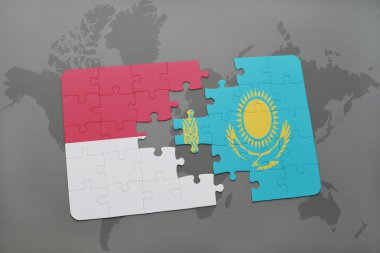 bir dünya haritası arka plan üzerinde endonezya ve Kazakistan ulusal bayrağı ile bulmaca.