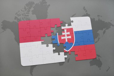 bir dünya haritası arka plan üzerinde endonezya ve slovakya ulusal bayrağı ile bulmaca.