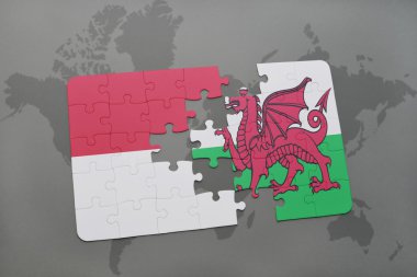 bir dünya haritası arka plan üzerinde Endonezya ve Galler ulusal bayrağı ile bulmaca.