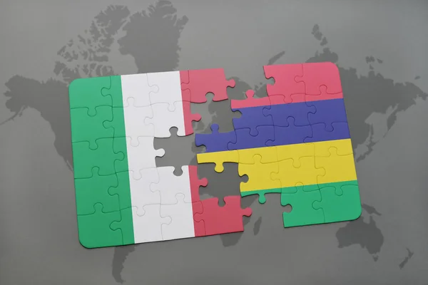 Puzzle with the national flag of italy and mauritius on a world map background. — Stock Photo, Image