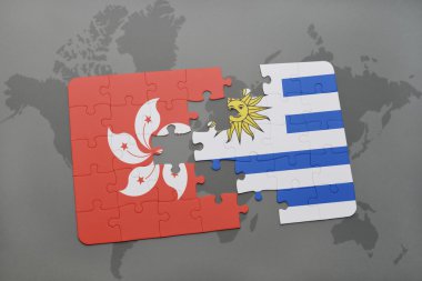 bir dünya haritası arka plan üzerinde hong kong ve uruguay ulusal bayrağı ile bulmaca.