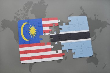 bir dünya haritası arka plan üzerinde malezya ve botsvana ulusal bayrağı ile bulmaca.