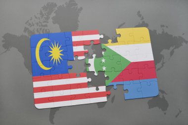 bir dünya haritası arka plan üzerinde malezya ve komor ulusal bayrağı ile bulmaca.