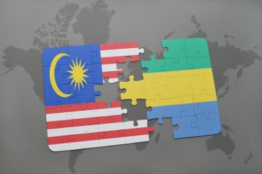bir dünya haritası arka plan üzerinde malezya ve gabon ulusal bayrağı ile bulmaca.