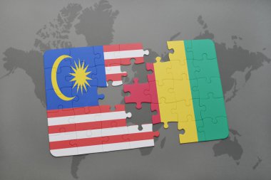 bir dünya haritası arka plan üzerinde malezya ve gine ulusal bayrağı ile bulmaca.