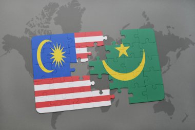 bir dünya haritası arka plan üzerinde malezya ve moritanya ulusal bayrağı ile bulmaca.