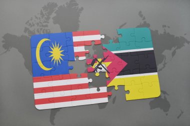 bir dünya haritası arka plan üzerinde malezya ve mozambik ulusal bayrağı ile bulmaca.