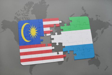 bir dünya haritası arka plan üzerinde malezya ve sierra leone ulusal bayrağı ile bulmaca.