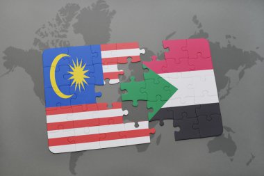 bir dünya haritası arka plan üzerinde malezya ve sudan ulusal bayrağı ile bulmaca.