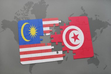 bir dünya haritası arka plan üzerinde malezya ve tunus ulusal bayrağı ile bulmaca.