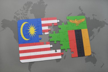 bir dünya haritası arka plan üzerinde malezya ve zambiya ulusal bayrağı ile bulmaca.