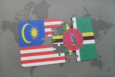 bir dünya haritası arka plan üzerinde malezya ve dominika ulusal bayrağı ile bulmaca.