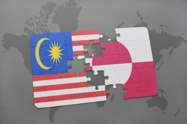 bir dünya haritası arka plan üzerinde malezya ve grönland ulusal bayrağı ile bulmaca.