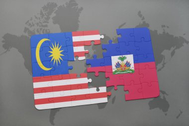 bir dünya haritası arka plan üzerinde malezya ve haiti ulusal bayrağı ile bulmaca.