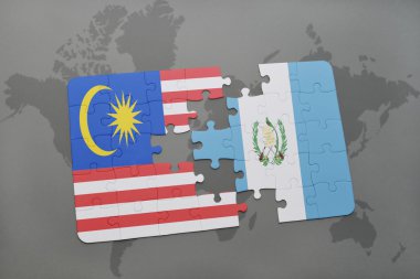 bir dünya haritası arka plan üzerinde malezya ve guatemala ulusal bayrağı ile bulmaca.