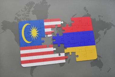 bir dünya haritası arka plan üzerinde malezya ve ermenistan ulusal bayrağı ile bulmaca.