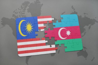 bir dünya haritası arka plan üzerinde malezya ve azerbaycan ulusal bayrağı ile bulmaca.
