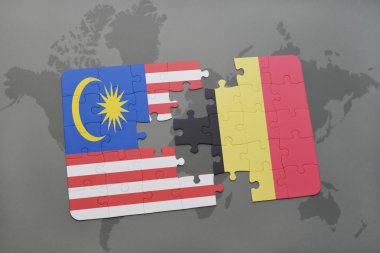 bir dünya haritası arka plan üzerinde Malezya ve Belçika ulusal bayrağı ile bulmaca.