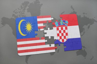 bir dünya haritası arka plan üzerinde malezya ve hırvatistan ulusal bayrağı ile bulmaca.
