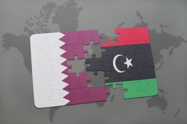 bir dünya haritası arka plan üzerinde Katar ve Libya ulusal bayrağı ile bulmaca.