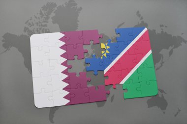 bir dünya haritası arka plan üzerinde katar ve namibya ulusal bayrağı ile bulmaca.