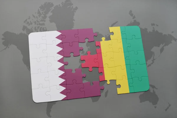 Puzzle with the national flag of qatar and guinea on a world map background. — Stock Photo, Image