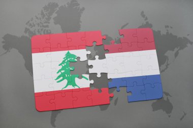 Lübnan ve Hollanda ulusal bayrak dünya harita arka plan üzerinde ile bulmaca.
