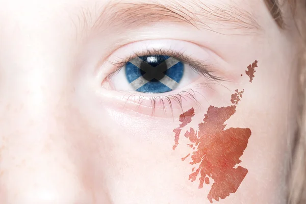 Human's face with national flag and map of scotland. — Stock Photo, Image