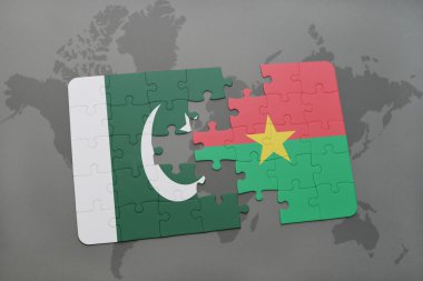 bir dünya haritası arka plan üzerinde pakistan ve burkina faso ulusal bayrağı ile bulmaca.