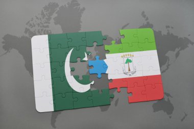 bir dünya haritası arka plan üzerinde pakistan ve ekvator ginesi ulusal bayrağı ile bulmaca.