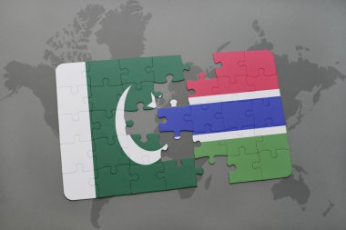 bir dünya haritası arka plan üzerinde pakistan ve gambiya ulusal bayrağı ile bulmaca.