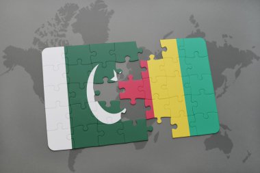 bir dünya haritası arka plan üzerinde pakistan ve gine ulusal bayrağı ile bulmaca.