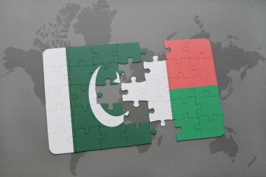 bir dünya haritası arka plan üzerinde pakistan ve madagaskar ulusal bayrağı ile bulmaca.