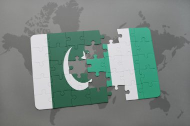 bir dünya haritası arka plan üzerinde pakistan ve nijerya ulusal bayrağı ile bulmaca.