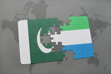bir dünya haritası arka plan üzerinde pakistan ve sierra leone ulusal bayrağı ile bulmaca.