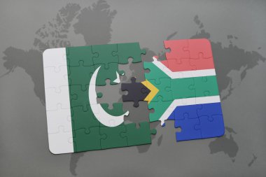 bir dünya haritası arka plan üzerinde pakistan ve güney Afrika ulusal bayrağı ile bulmaca.