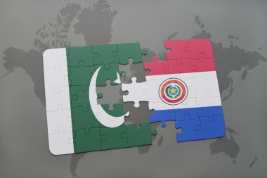 bir dünya haritası arka plan üzerinde pakistan ve paraguay ulusal bayrağı ile bulmaca.