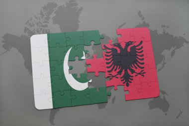 bir dünya haritası arka plan üzerinde pakistan ve arnavutluk ulusal bayrağı ile bulmaca.