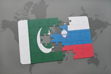 bir dünya haritası arka plan üzerinde pakistan ve slovenya ulusal bayrağı ile bulmaca.