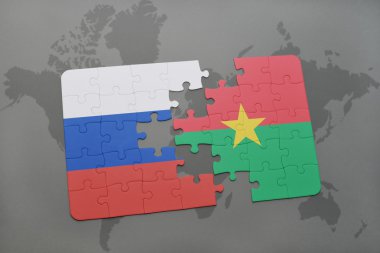 bir dünya haritası arka plan üzerinde Rusya ve burkina faso ulusal bayrağı ile bulmaca.