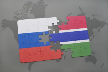 bir dünya haritası arka plan üzerinde Rusya ve Gambiya ulusal bayrağı ile bulmaca.