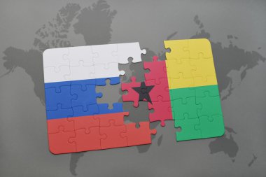 bir dünya haritası arka plan üzerinde rusya ve gine bissau ulusal bayrağı ile bulmaca.